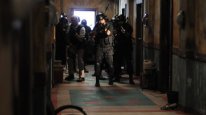 кадри з фільму Рейд: Спокута